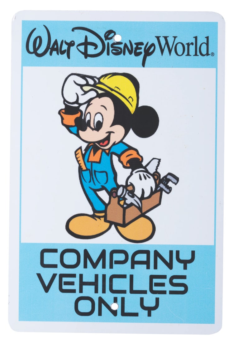 A Walt Disney World "Company Vehicles Only" Sign.: (Walt Disney World, 1990s) A metal parking sign featuring Mickey Mouse used to designate spaces for company vehicles at Walt Disney World. Measuring 12" x 18" the sign is in very good, Park-used
