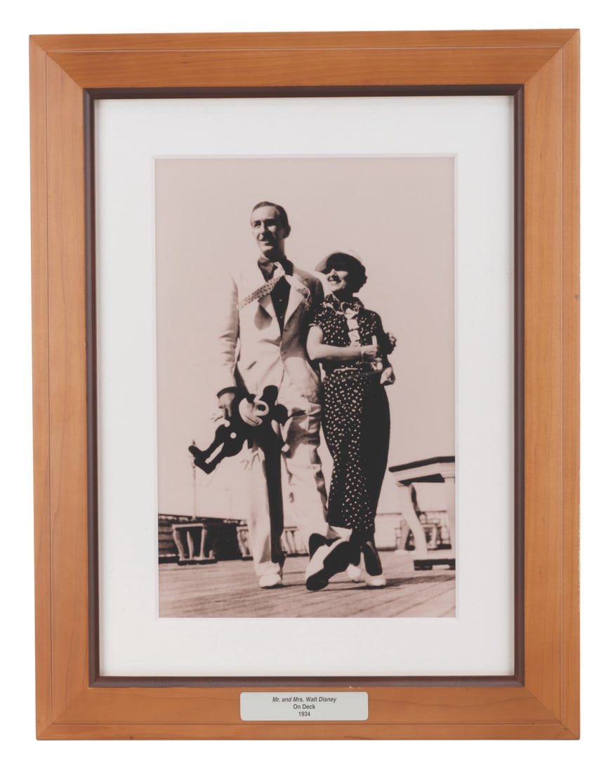 A Cabin Decor Photo of Walt & Lillian Disney from the Disney Magic.: (Disney Cruise Line, 2010s) A framed photograph of Mr. and Mrs. Disney from the Disney Magic Cruise ship. This photo of Walt and Lillian on the deck of the Rex in 1934 decorated the staterooms of