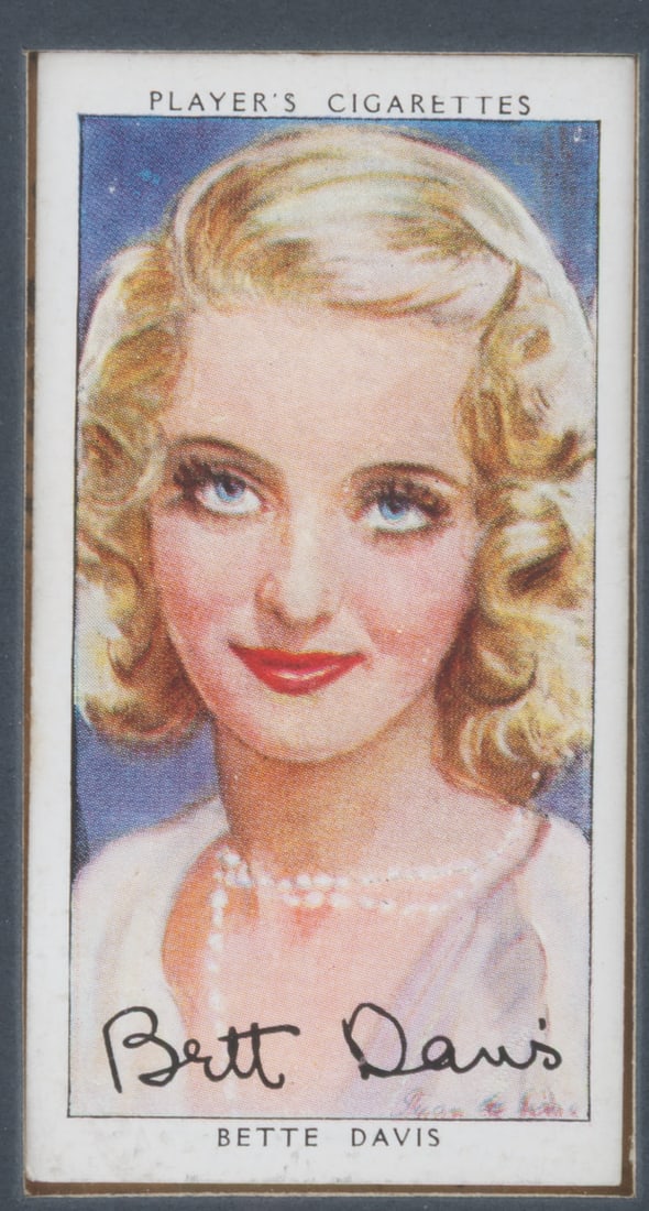 A Framed Bette Davis Player's Cigarette Card. (1 of 2)
