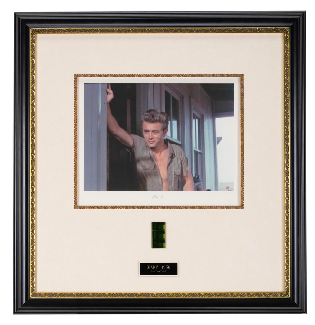 A James Dean "Giant" Film Strip with Print.: (Hollywood Archive Collectibles, 1994) A framed print and matching 35mm film strip of James Dean from the Tea Scene in "Giant." With a 9-volt battery (not included), the film strip lights up when a