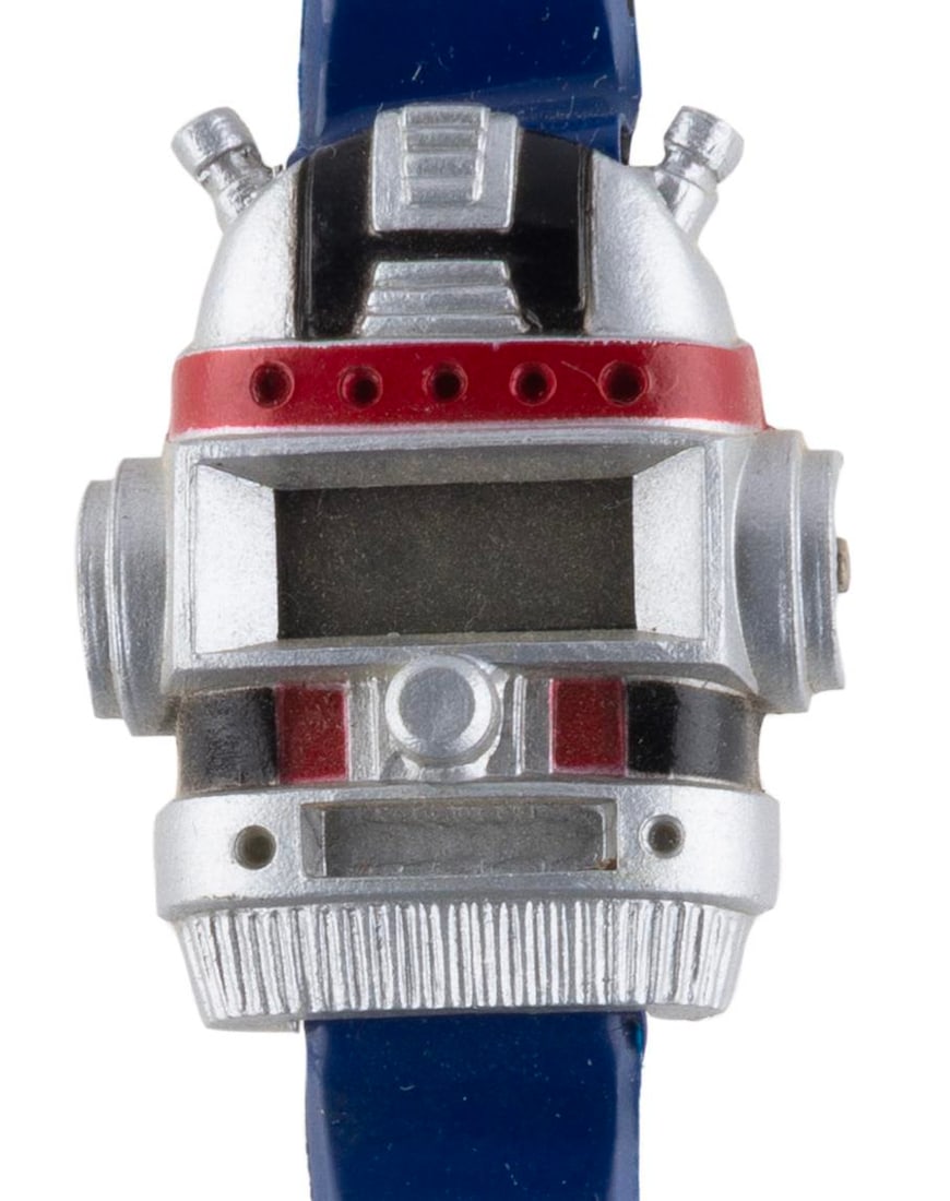 A 1980s Robot Head Children?s Watch.: (1980s) A children's robot head digital wristwatch, likely meant to evoke popular shows of the time, such as Transformers or Gundam. The watch is sold untested and likely requires a new battery or
