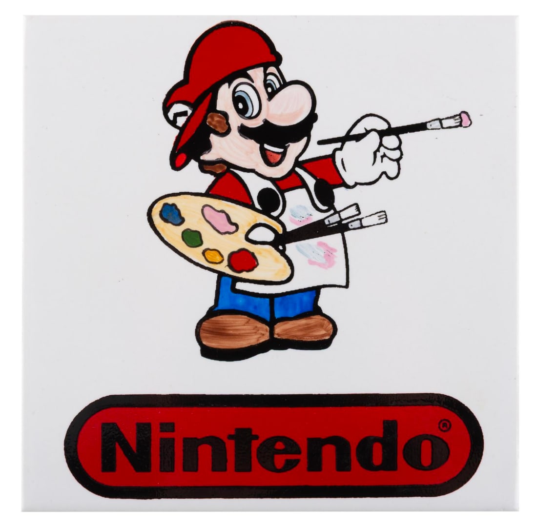 A Rare Super Mario Nintendo Decorative Ceramic Tile.: (Nintendo, 1990s) A ceramic tile of Mario as a painter holding a palette and brush, with the Nintendo logo below. This was a sample made for a potential merchandise item. Measuring 6" x 6", the tile