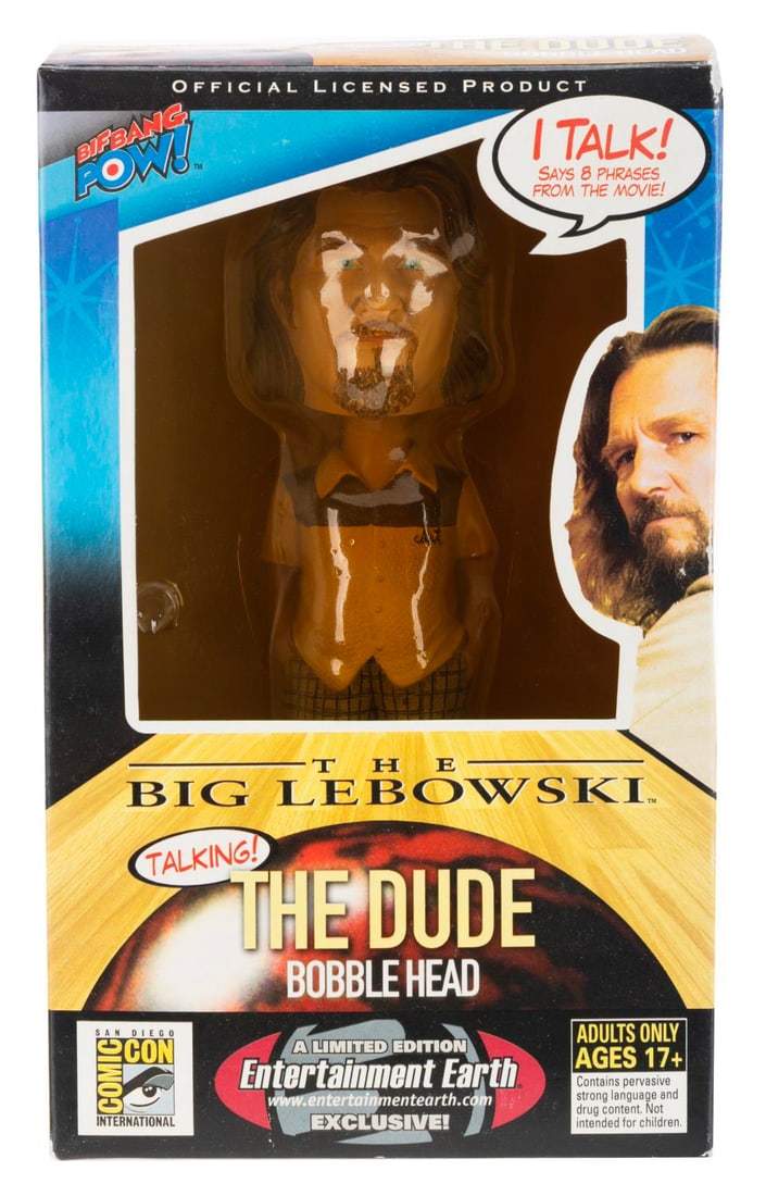An SDCC "The Big Lebowski" The Dude Talking Bobblehead.: (Bif Bang Pow!, 2000s) A rare Entertainment Earth exclusive talking bobblehead of Jeff Bridges' The Dude from "The Big Lebowski, released at San Diego Comic-Con. Measuring 8" tall in its original box