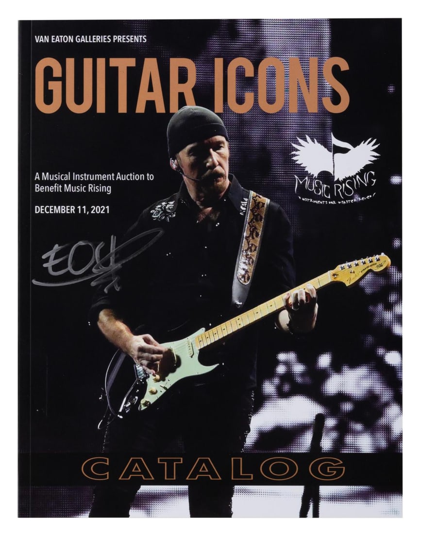 A Van Eaton Galleries Guitar Icons Catalog Signed by The Edge.: (Van Eaton, 2021) A Van Eaton Galleries Guitar Icons auction catalog signed by guitarist The Edge from U2 in bold silver marker. The musical instrument auction benefitting Music Rising was held on