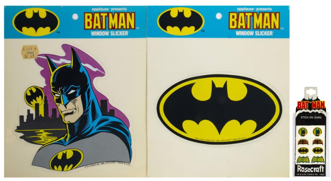 A Collection of Batman Stickers.: (DC, 1982/89) A collection of three packages of vintage Batman stickers. The two larger packages were created by Rosecraft, and the smaller package of "stick-on ears" pairs was created by Applause.