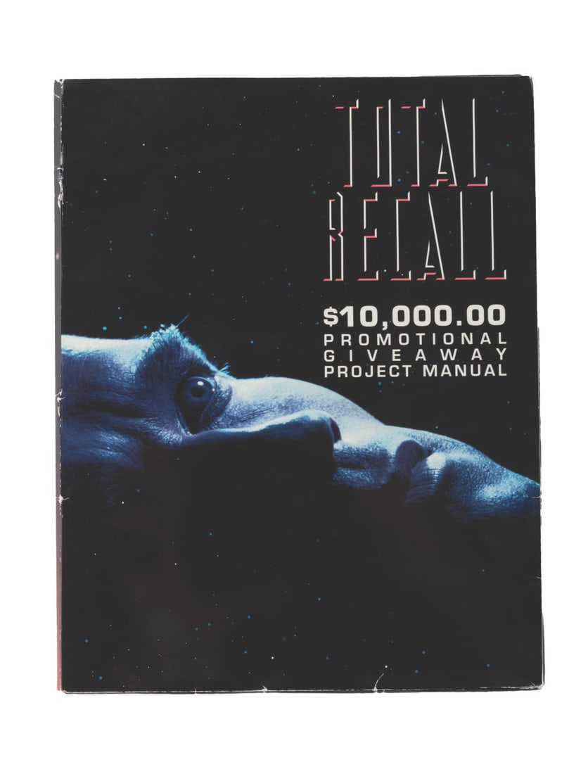 A 1990 "Total Recall" Promotion Manual.: (Tri Star, 1990) A promotional manual for Arnold Schwarzenegger?s "Total Recall." The tri-fold folder outlines for theater managers the schedule for posters, trailers, and promo events leading up to