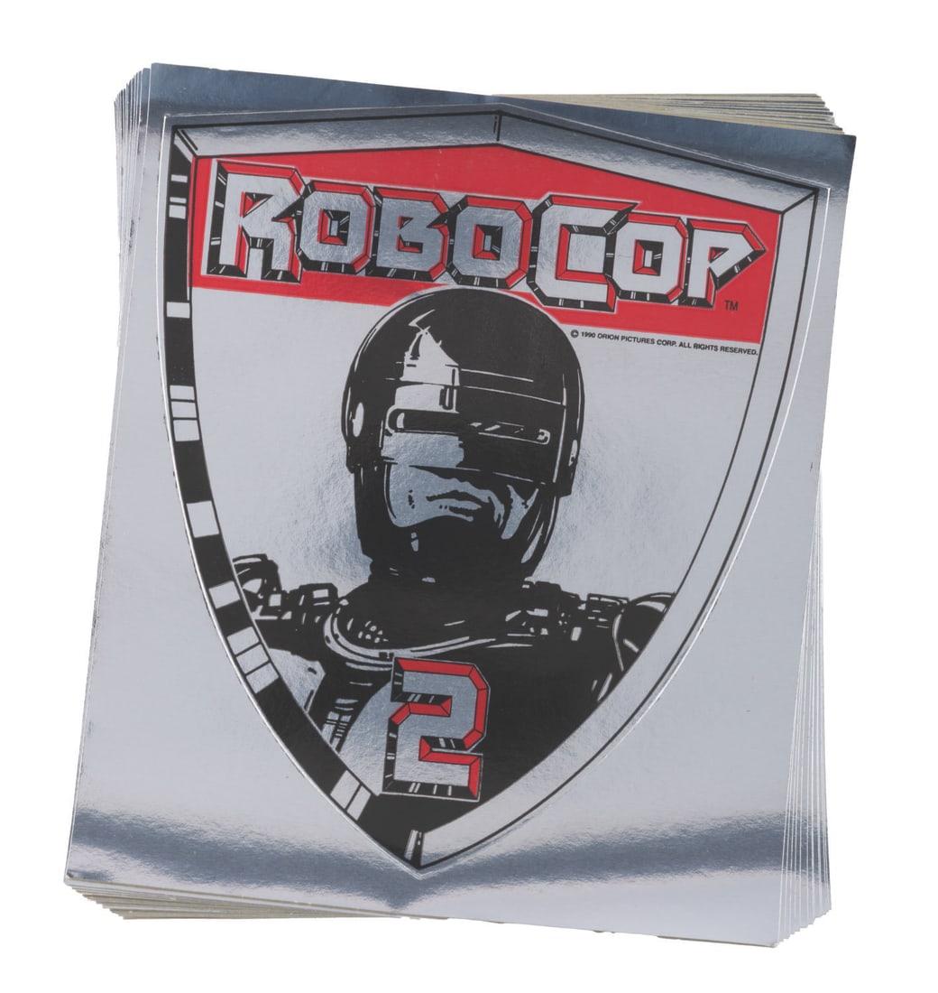 A Set of "RoboCop 2" Promotional Stickers.: (Orion, 1990) Sixteen promotional metallic foil stickers for "RoboCop 2." Measuring 5.25" x 6", the stickers are in very good condition with light creases to the edges.