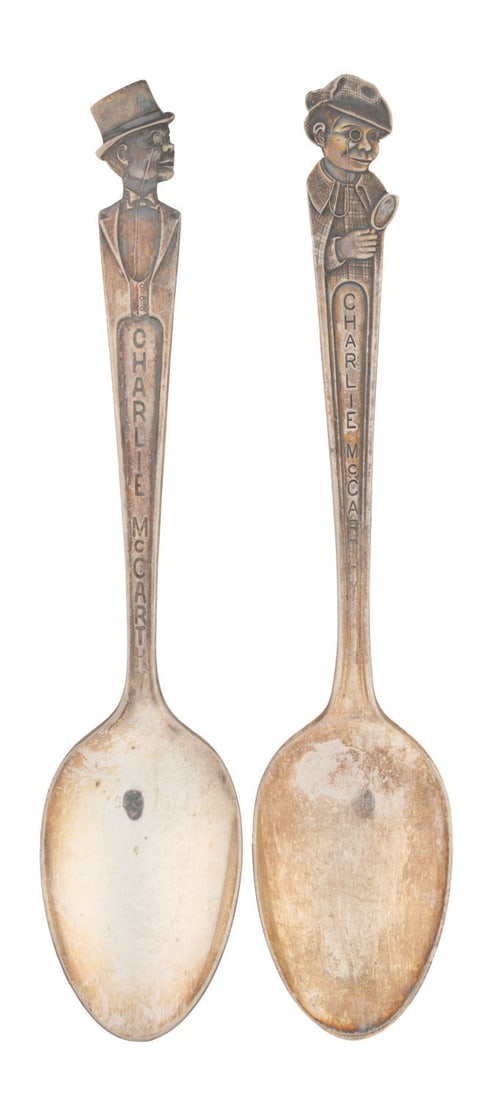 A Pair of Charlie McCarthy Spoons.: (Duchess Silver Plate, 1939) A pair of Charlie McCarthy silver plate spoons, released at the height of the ventriloquist dummy?s fame in 1939. Included are both Charlie in his standard tuxedo and the