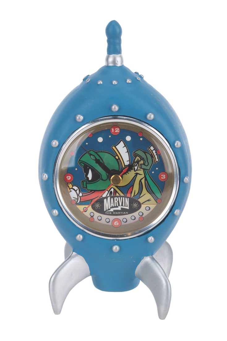 A Marvin the Martian Alarm Clock.: (Warner Bros., 1995) A spaceship-shaped alarm clock featuring Marvin the Martian and K-9. The clock did not work when tested, likely requiring repair. Measuring 4" x 3.5" x 7.5" tall, the clock is in