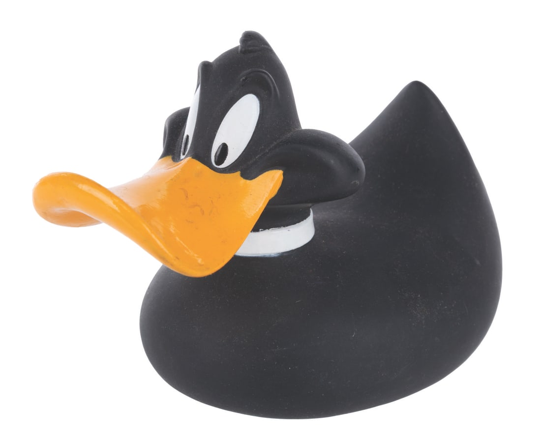 A Rare 1997 Daffy Duck Rubber Duck.: (Warner Bros. Store,1997) A rare vinyl bathtub-style Daffy Duck, originally sold at the Warner Bros. Store. Measuring 6.5" x 3.5" x 4" tall, the duck is in very good condition.
