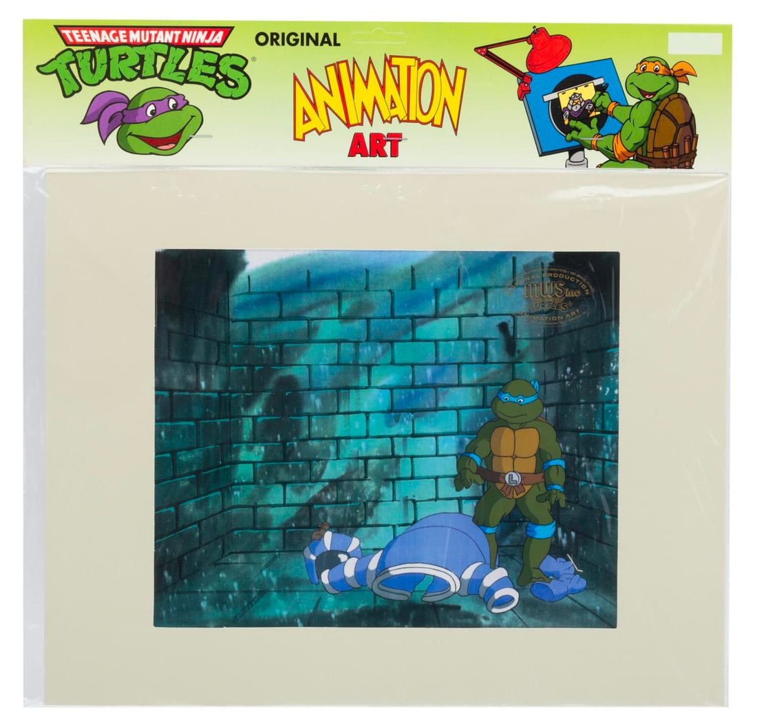 A "Teenage Mutant Ninja Turtles" Original Production Cel.: (Murakami-Wolf-Swenson, 1987-91) An original production cel of Leonardo from "Teenage Mutant Ninja Turtles." Leonardo has an image size of 4.25" x 2.25" in an 11" x 14" matte. The cel is sealed in