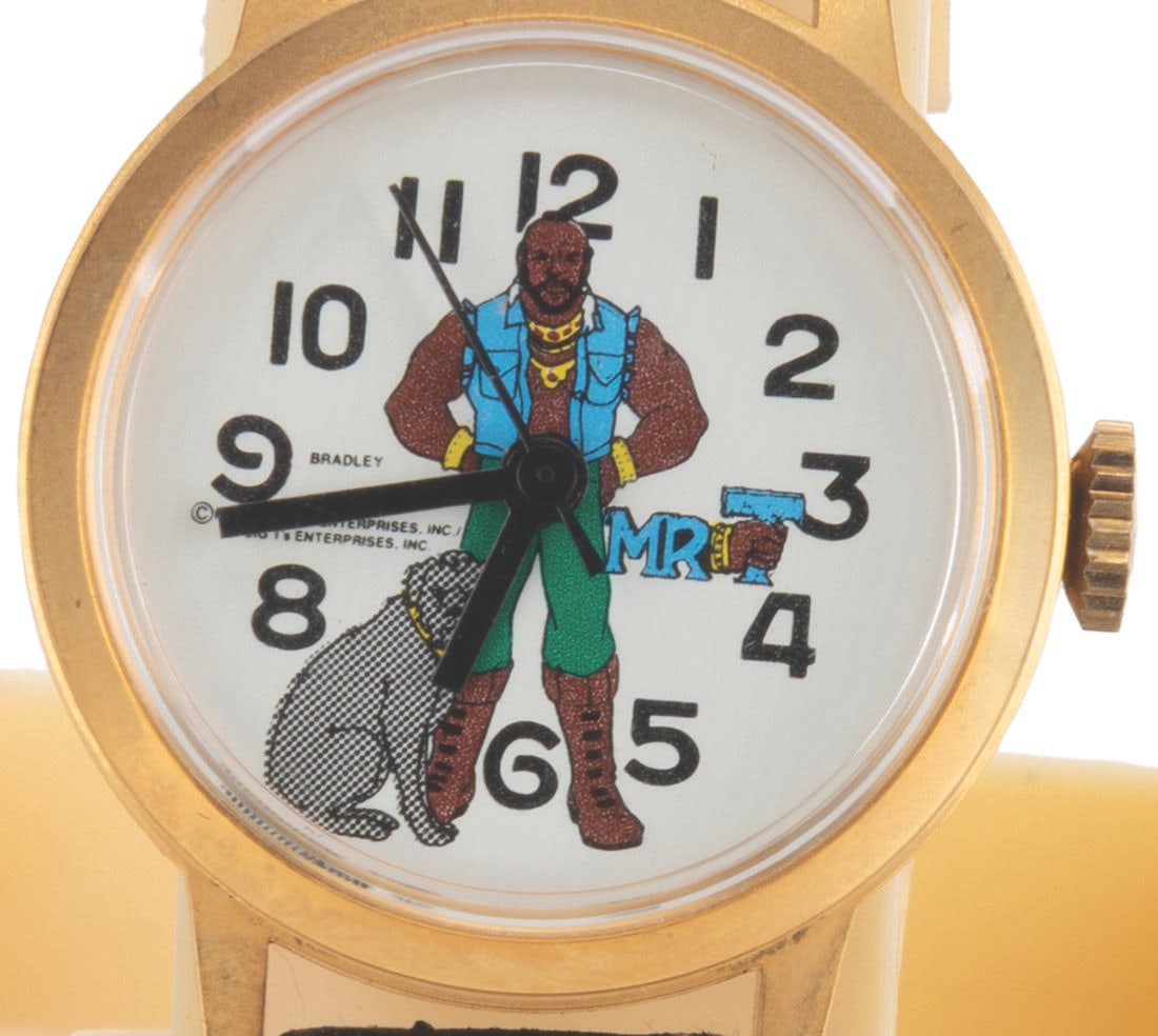 A Mr. T. Wristwatch.: (Bradley, 1983) A wristwatch featuring Mr. T and a dog, manufactured by Bradley. The watch did not work when tested, likely requiring service or a new battery. The watch featuring "The A-Team" star