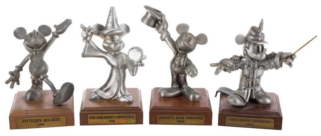 A Collection of Mickey Mouse Pewter Figurines.: (Hudson, 1990s) A four piece limited edition collection of "The Generations of Mickey" pewter figurines. The figurines were released in editions of 2500 and feature Mickey through the years including