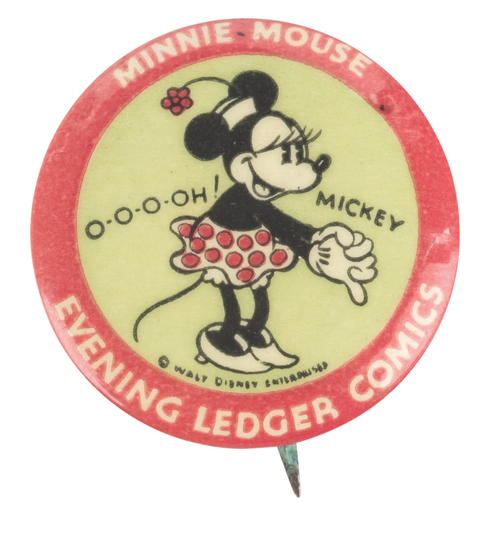 A Minnie Mouse Evening Ledger Comics Button.: (Disney, 1930s) A promotional Minnie Mouse button advertising Mickey Mouse comics appearing in the Philadelphia Evening Ledger newspaper. Measuring 1.25" in diameter, the button is in very good