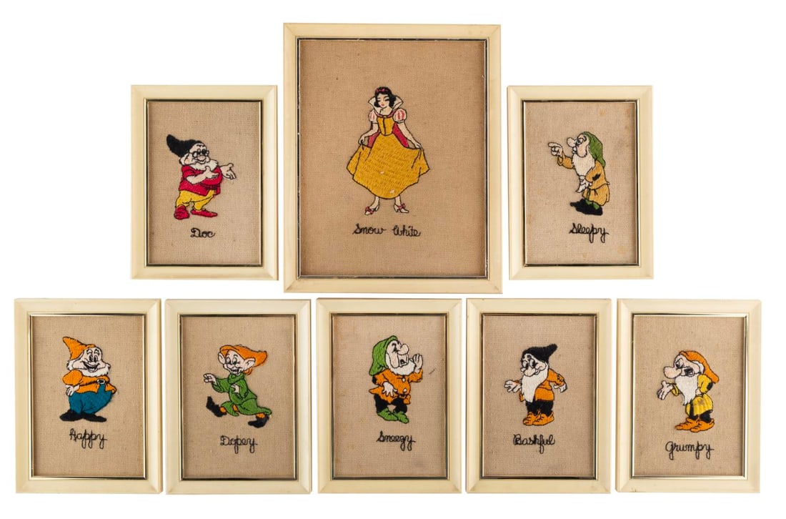 A Framed "Snow White and the Seven Dwarfs" Embroidery Set.: (Disney, 1960s) A framed set of eight "Snow White and the Seven Dwarfs" embroideries featuring Snow White and each Dwarf from the groundbreaking film. Ranging in size from 6" x 8" to 9" x 11", the fra