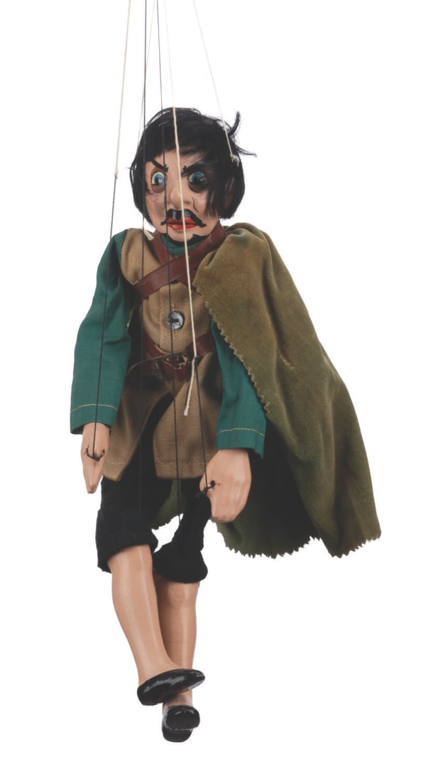 A "Snow White" Huntsman Madame Alexander Marionette.: (Madame Alexander, 1930s) A Huntsman marionette from "Snow White and the Seven Dwarfs." The Huntsman has been partially restrung and retains both original and new control cords and handles. Measuring 