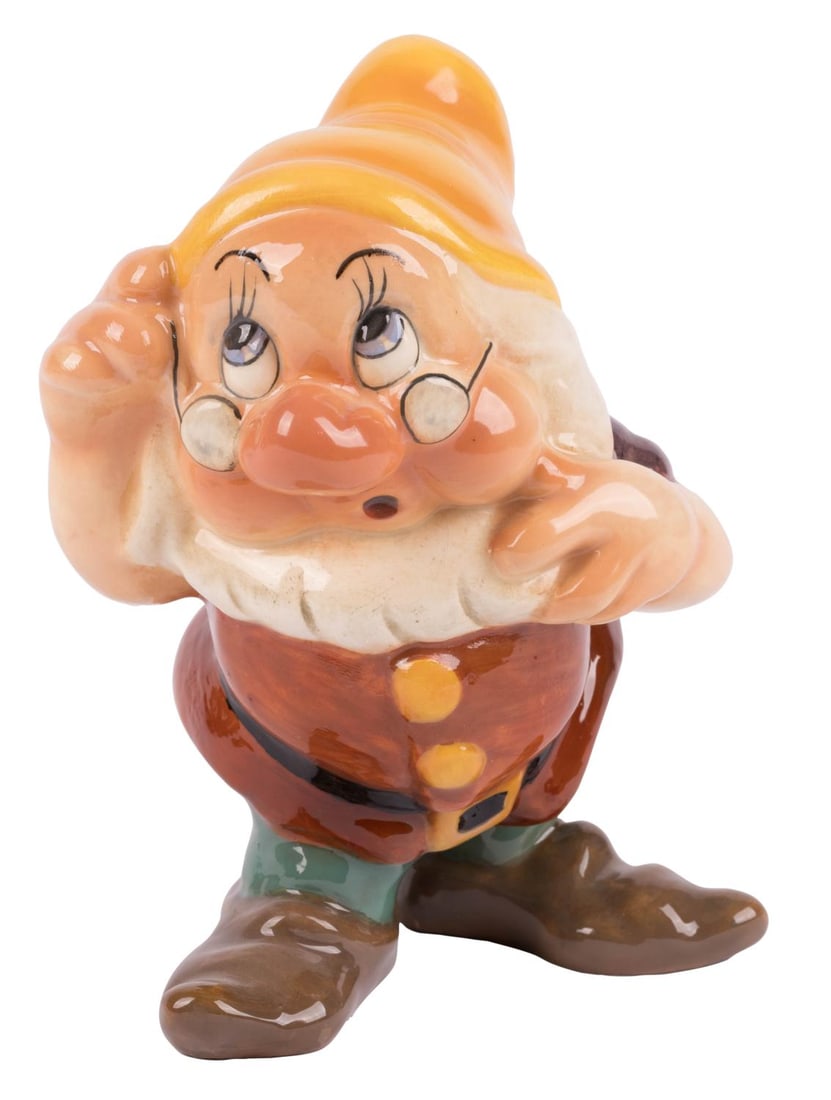 A "Snow White" Doc Large Ceramic Figurine by Zaccagnini.: (Zaccagnini, 1940s) A ceramic figurine of Doc from the animated film "Snow White and the Seven Dwarfs." The ceramic of the unofficial leader of the dwarfs was produced by Zaccagnini of Florence,