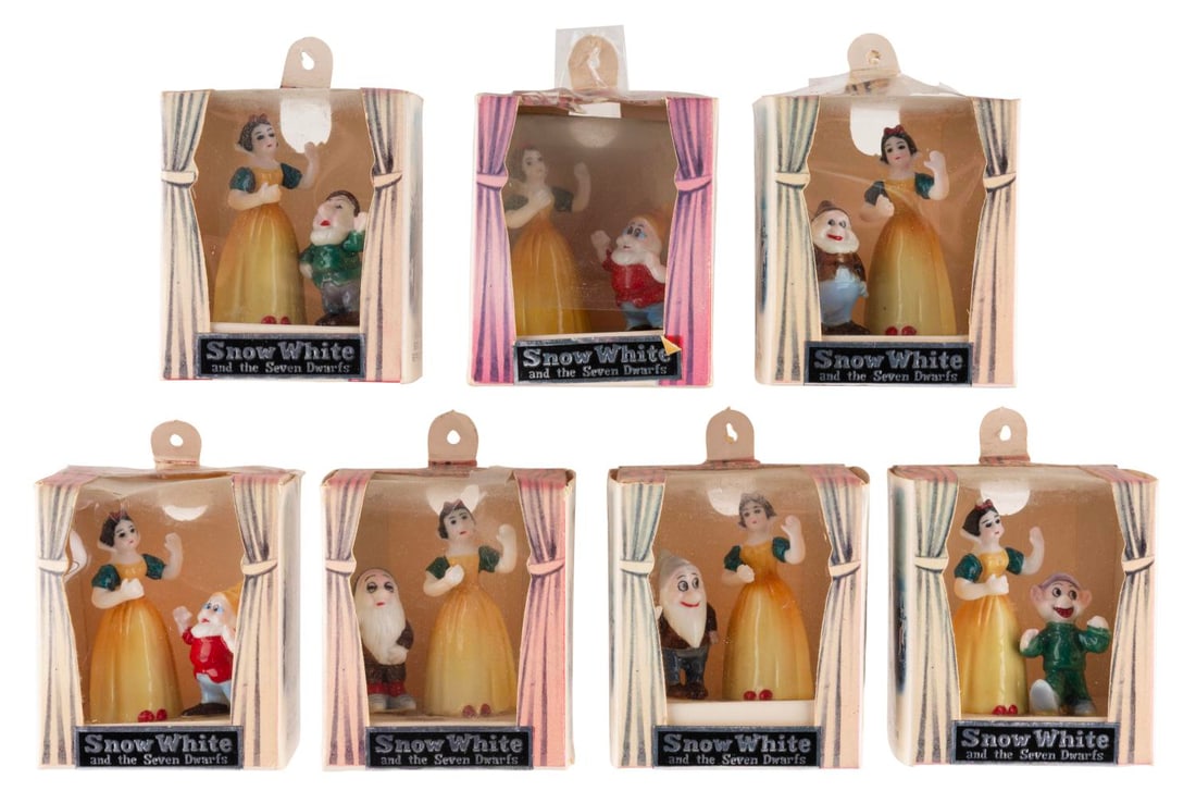 A "Snow White and the Seven Dwarfs" Figurine Set. (1 of 8)