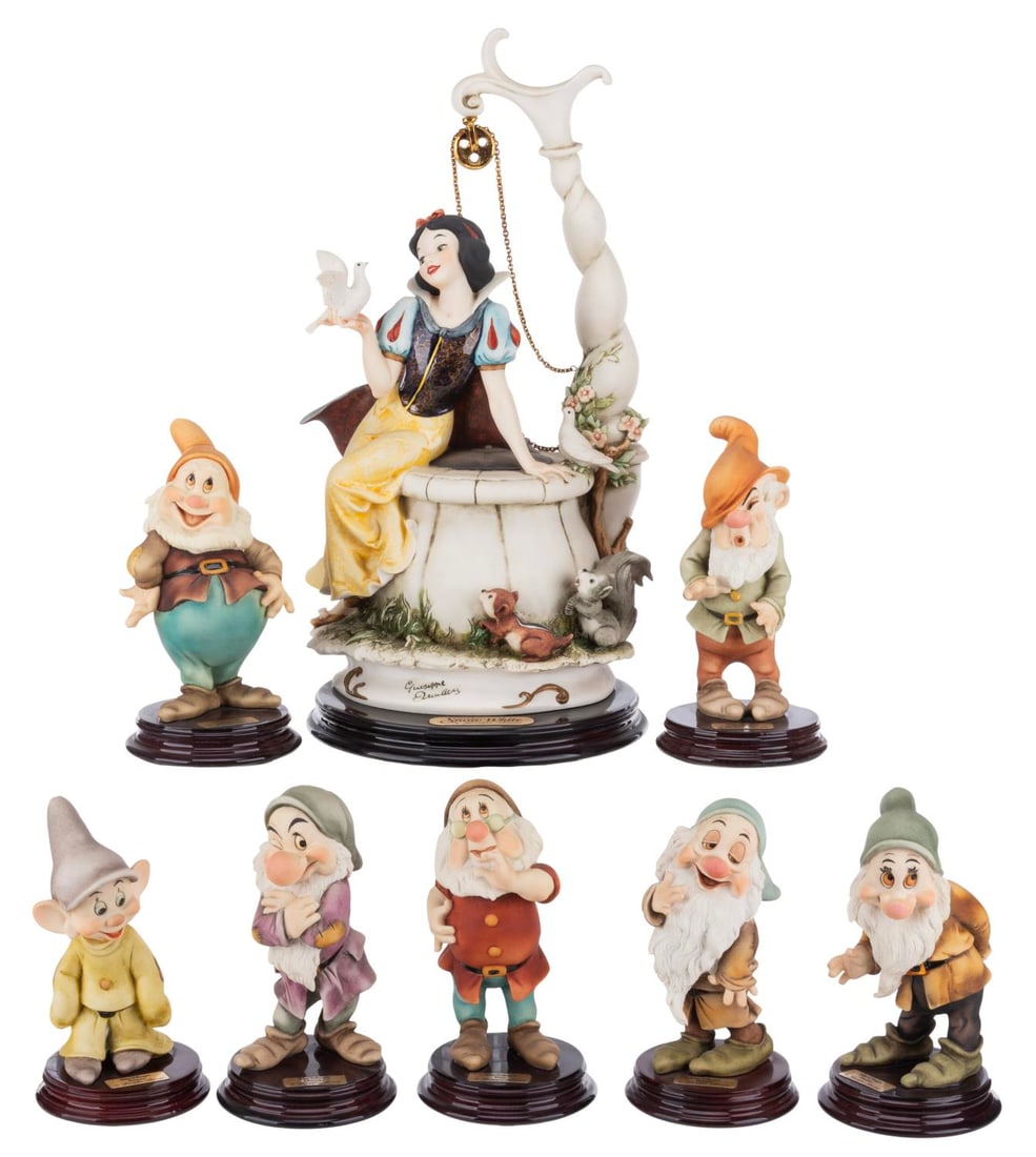 A "Snow White" Giuseppe Armani Sculpture Set.: (Armani, 1993-95) A complete set of eight "Snow White and the Seven Dwarfs" fine art sculptures by Giuseppe Armani. Snow White, Happy, Sleepy, Sneezy, and Doc are all signed by the artist, and Snow