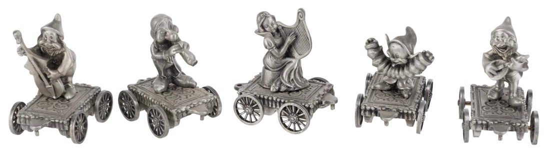 A Set of "Snow White and the Seven Dwarfs" Pewter Train Figures.: (Hudson Pewter, 1980s-90s) A collection of five "Snow White and the Seven Dwarf" pewter figurines, released in the Mickey?s Music Train Collection. Included are Snow White, Dopey, Doc, Grumpy, and