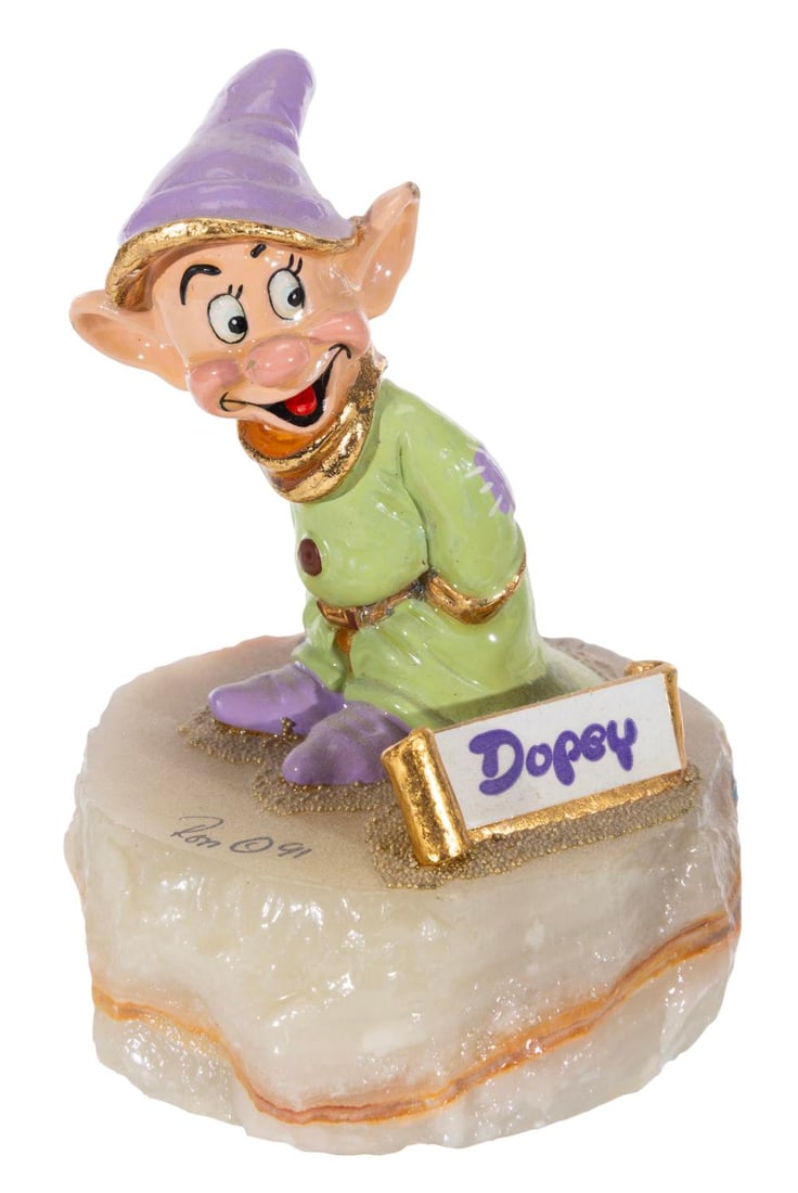 A "Snow White" Dopey Sculpture.: (Ron Lee, 1991) A hand-painted figurine of Dopey from "Snow White and the Seven Dwarfs, signed by the artist Ron Lee on the base and numbered 132/2750. The statue is composed of metal plated with 24 k