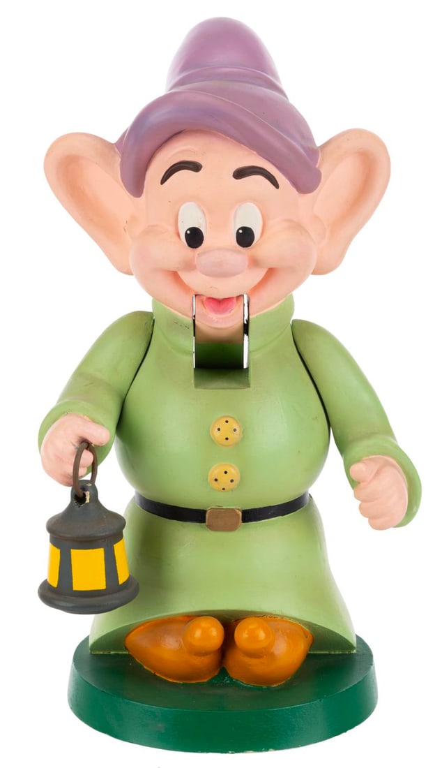A Disney Store Dopey Nutcracker.: (Disney, 1993) A nutcracker of Dopey from "Snow White and the Seven Dwarfs," created exclusively for The Disney Store's Made in Santa's Workshop line. Measuring 5.5" x 5" x 10" tall, the wood and