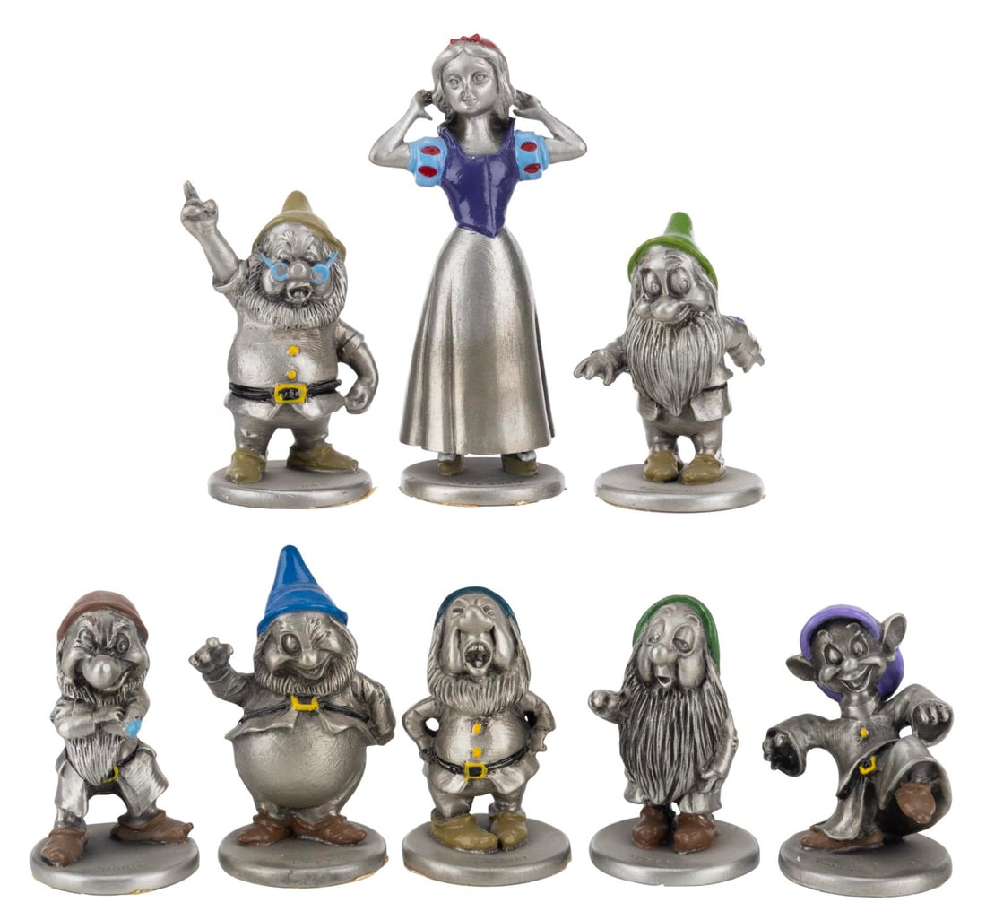 A "Snow White and the Seven Dwarfs" Pewter Set.: (Hudson, 1980s-90s) A set of eight "Snow White and the Seven Dwarfs" figurines by Hudson Pewter. Ranging from 2" to 3.25" tall, the pewter figurines are in very good condition with light wear.