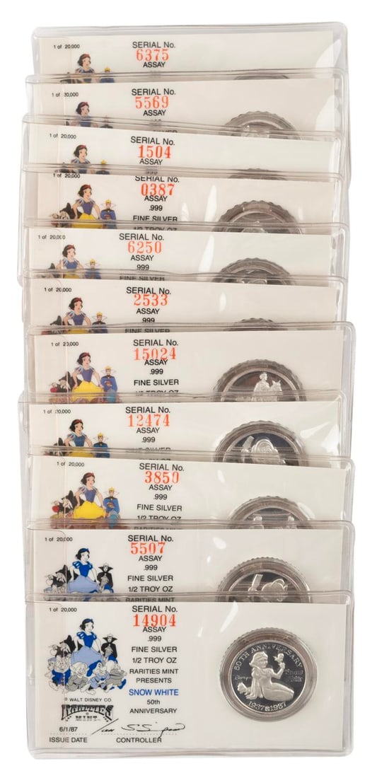 A "Snow White" 50th Anniversary Silver Coins Set.: (Rarities Mint, 1987) A complete set of 11 silver coins released to celebrate the 50th anniversary of Walt Disney?s first animated feature "Snow White and the Seven Dwarfs." Featured are Snow White,