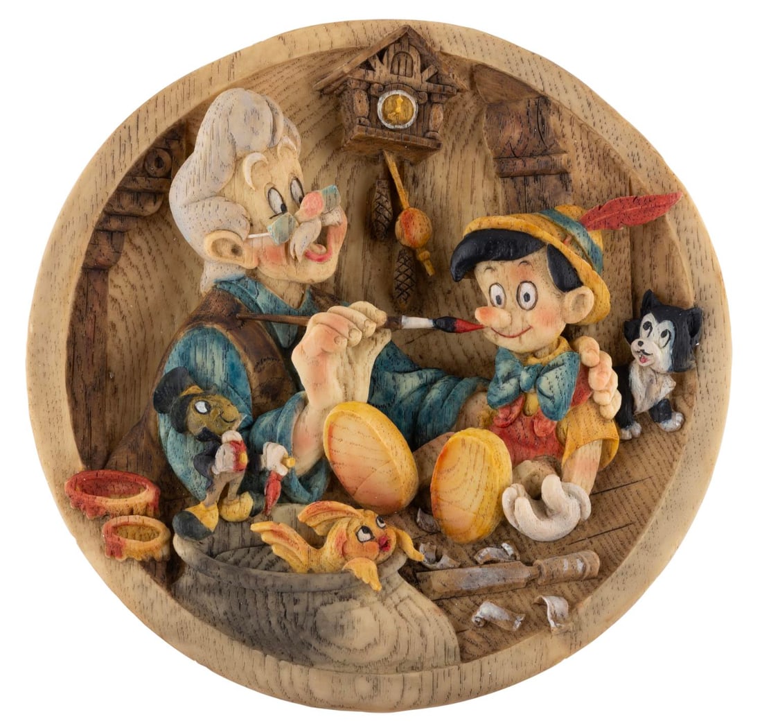 A "Pinocchio" Decorative Plate.: (Disney, 1990s-2000s) A "Pinocchio" decorative plate produced in Italy featuring a relief of Geppetto, Figaro, Cleo, and Pinocchio, released in a limited edition and numbered 0453. Measuring 8.75 "