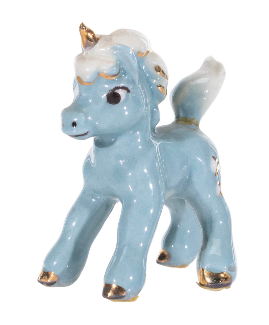 A 1950s "Fantasia" Ceramic Blue Unicorn Figurine.: (Hagen-Renaker, 1950s) A miniature blue baby Unicorn figurine from the Pastoral Symphony of "Fantasia," released by Hagen Renaker. 1.75" tall, the ceramic displays in very good condition with crazing 