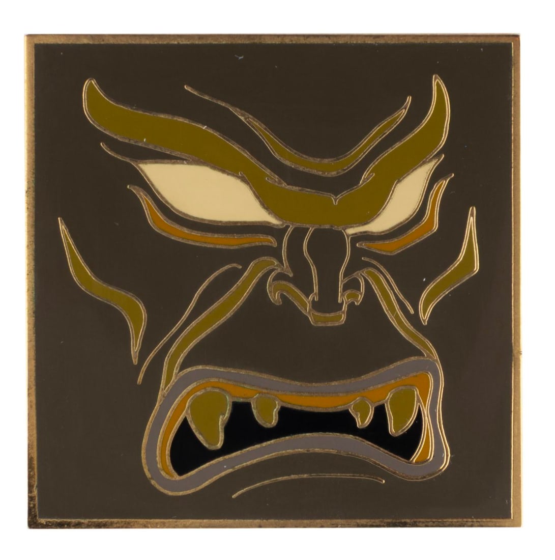 A Disney Auctions Exclusive Chernabog Face Pin.: (Disney, 2004) A Disney Auctions pin of Chernabog, released in a limited edition of only 250. Measuring 1.75" x 1.75", the pin is in very good condition with light edge wear.