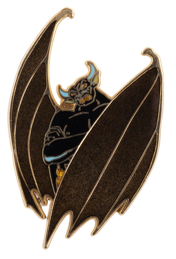 A Limited Edition 500 Chernabog Pin.: (Disney Shopping, 2008) A pin of Chernabog with golden wings, released in a limited edition of 500 exclusively through Disney Shopping. Measuring 1.25" x 2", the pin is in fine condition.