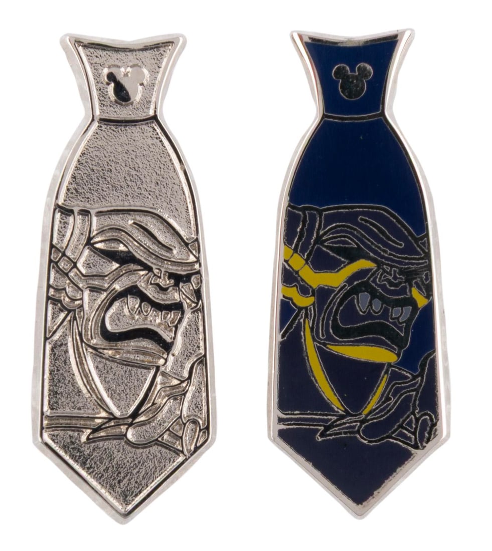 A Pair of Chernabog Hidden Mickey Tie Pins.: (Disney, 2015) A pair of Hidden Mickey Chernabog tie pins, including the full color pin and the silver tone chaser. Measuring 1.25" long each the pins are in very good condition.
