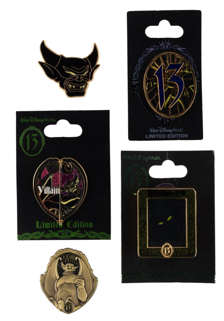 A Set of "13 Reflections of Evil" Limited Edition Pins.: (Walt Disney World, 2013) A collection of five limited edition pins from the 13 Reflections of Evil event at Walt Disney World in 2014. Included are a limited edition 750 "Countdown" pin from 2012,