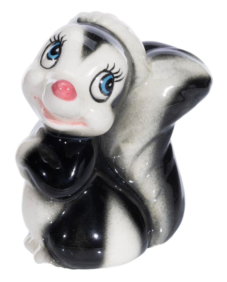 A "Bambi" Flower Ceramic Figure.: (Shaw, 1940s) A painted glazed ceramic figurine of Flower from "Bambi" by Evan K. Shaw. Standing 3.5" tall, the figurine is in very good condition with a chip from the bottom of the left foot and