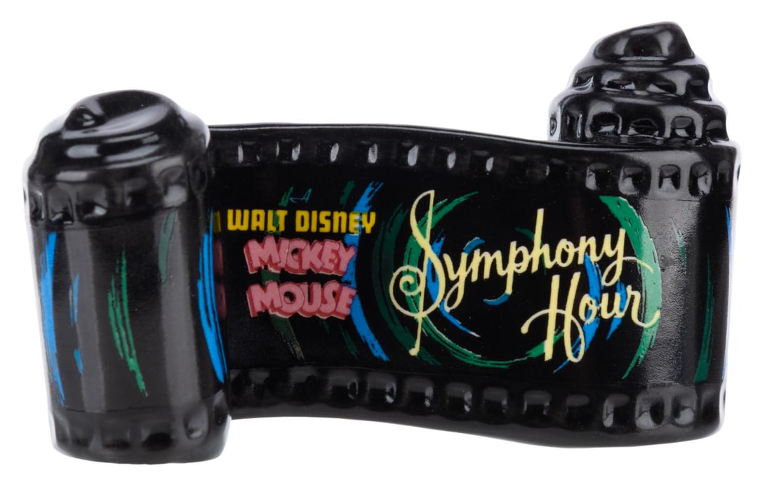 A WDCC "Symphony Hour" Title Scroll.: (WDCC, 1993-97) A Walt Disney Classics Collection ceramic opening title scroll for the Mickey Mouse short "Symphony Hour." Measuring 2" x 3.25", the item is in fine condition.