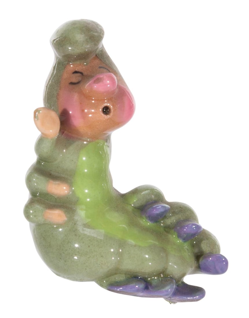 An "Alice in Wonderland" Caterpillar Figurine.: (Hagen-Renaker, 1950s) A rare figurine of the Caterpillar from "Alice in Wonderland" by renowned Californian ceramist, Hagen Renaker. Measuring 2" tall, the ceramic displays in very good condition
