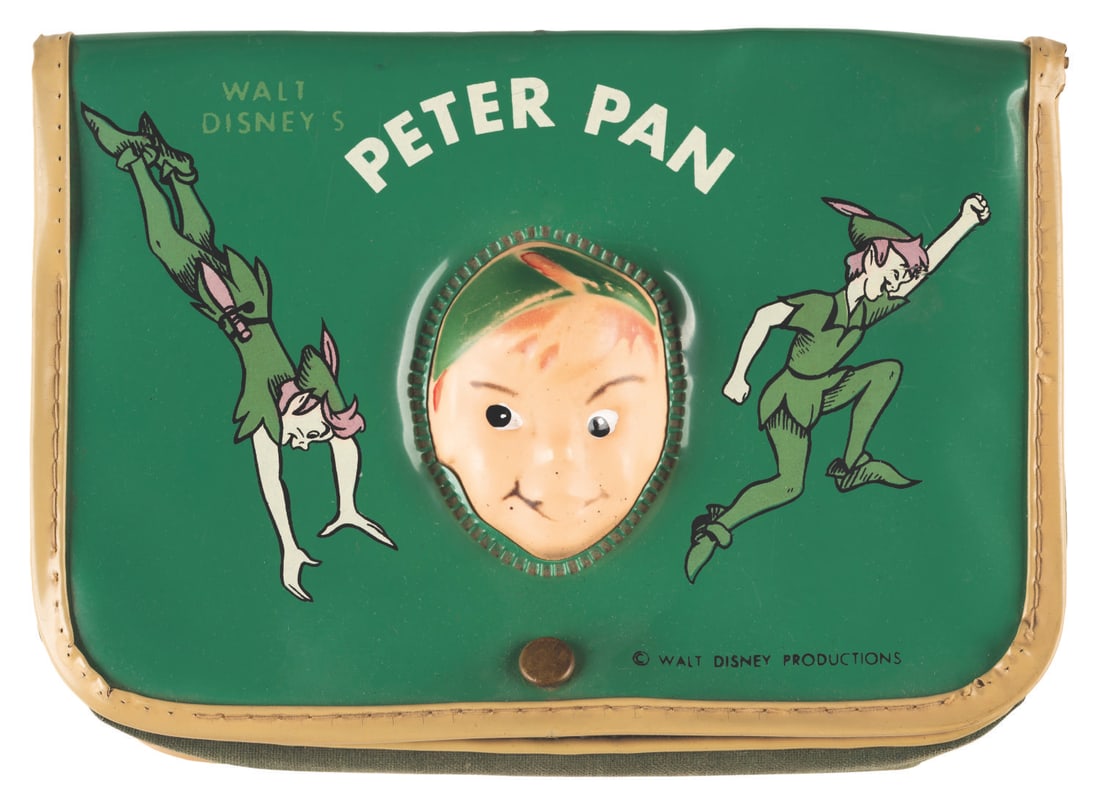 A Rare "Peter Pan" Green Vinyl Bag.: (Disney, 1950s) A rare bag featuring a raised Peter Pan head on the cover. Measuring 5" x 7.5", the bag displays in good condition with heavy discoloration from age, scratches, soiling, flaking on