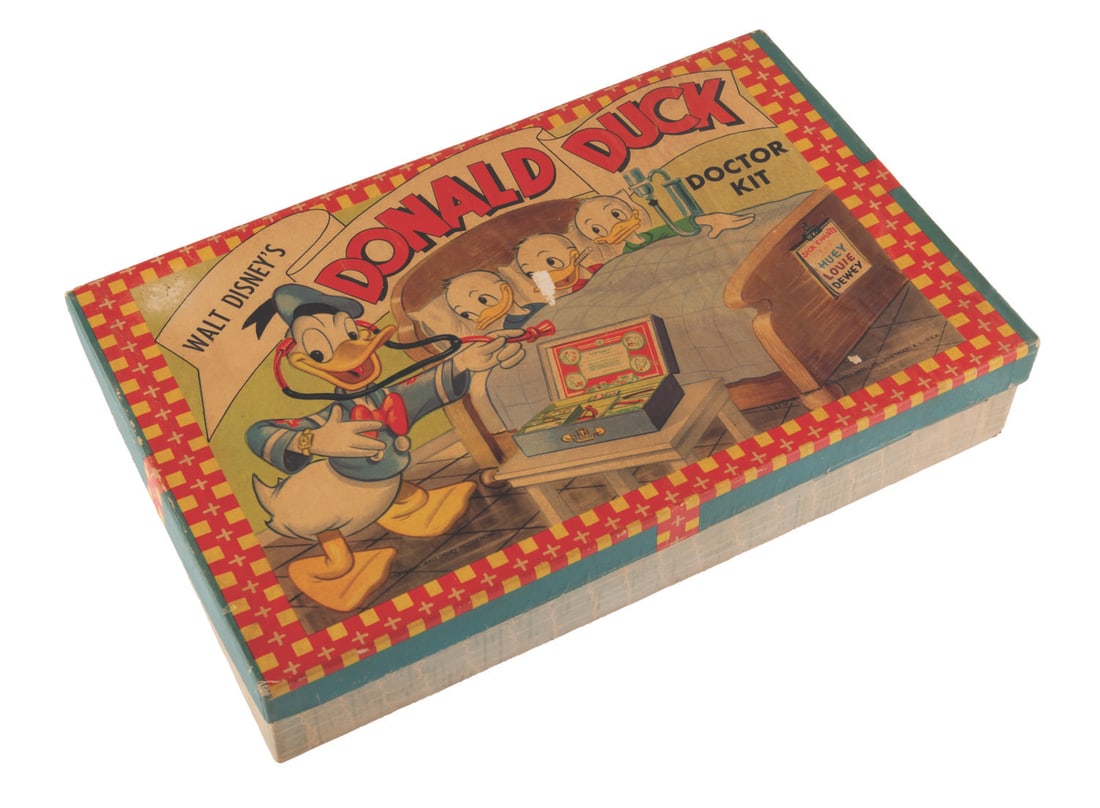 A 1950s Donald Duck Doctors Kit.: (Toyville, 1950s) A Donald Duck Doctor Kit, included in the cardboard carrying case, is a stethoscope, eye & ear tester, junior tablets box, a thermometer, gauze, height and weight chart, a doctor's