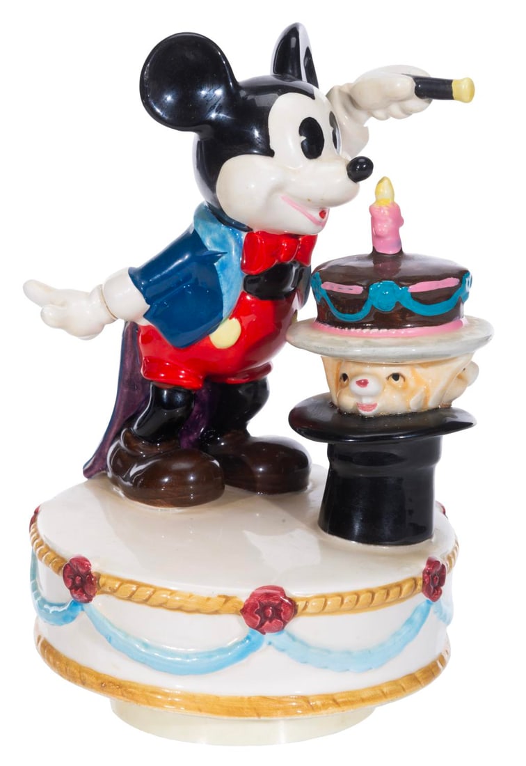 A Magician Mickey Mouse Birthday Cake Music Box.: (Schmid, 1970s-80s) A ceramic music box of Mickey Mouse as a magician, which plays "It's a Small World" when wound. The music box worked when tested, playing a slowed-down version of the Sherman