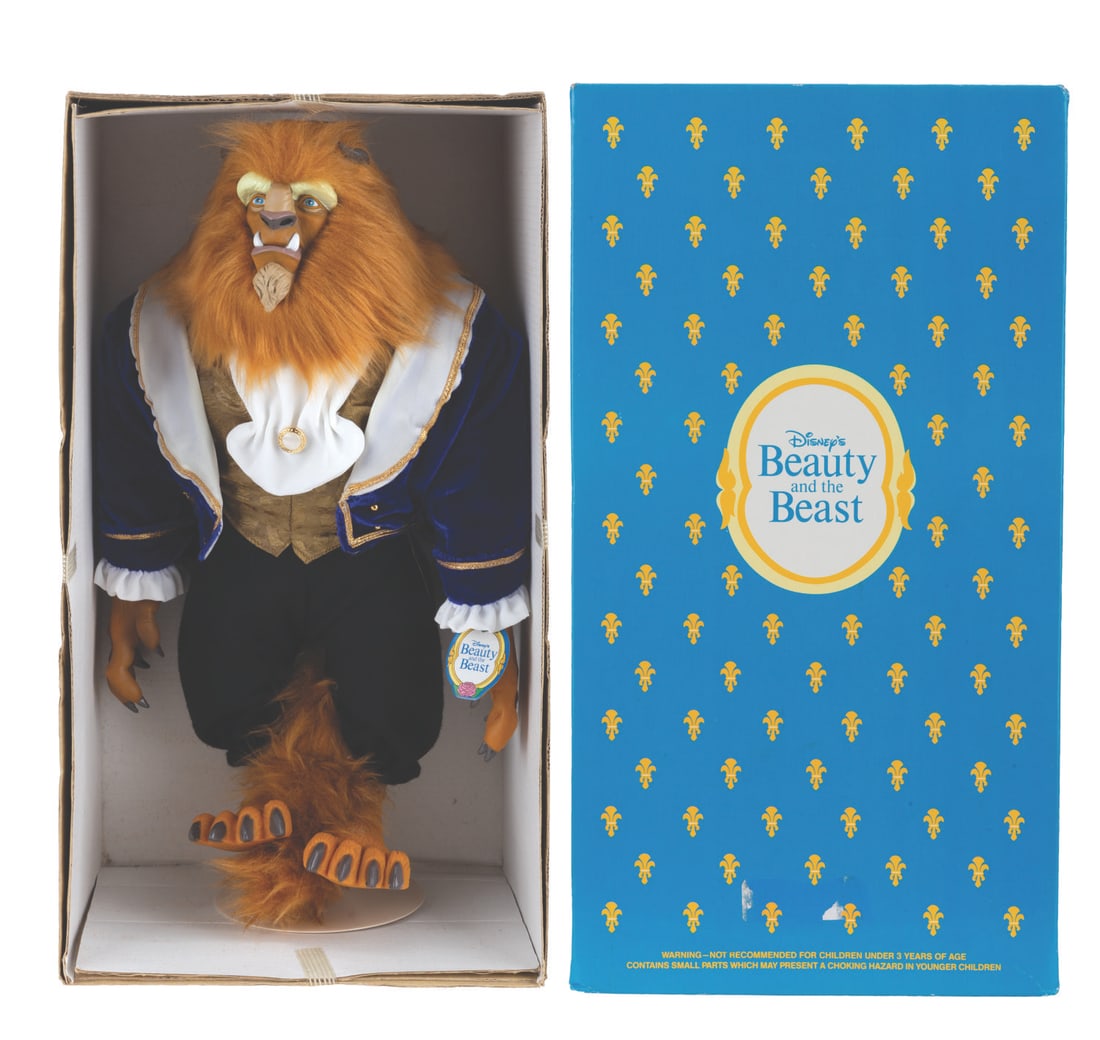 A Beast Doll from "Beauty and the Beast.": (Dakin, 1990s) A doll of Beast in his elegant dinner outfit from "Beauty and the Beast." The doll features fabric elements with a plastic face and hands. Measuring 14" tall in its 8.5" x 6" x 15.5"
