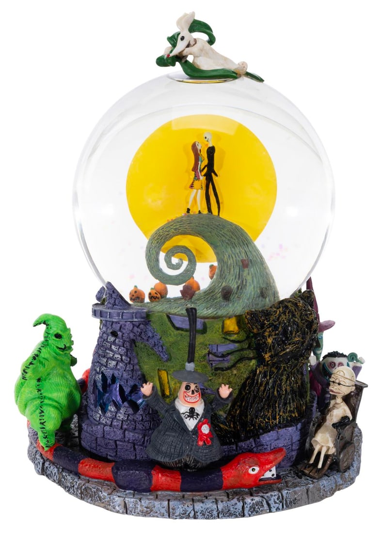 A "The Nightmare Before Christmas" Snow Globe.: (Disney, 1993) The earliest musical snowglobe based on Tim Burton's "The Nightmare Before Christmas." These were the first Nightmare-themed snowglobes offered at The Disney Store, depicting Jack and