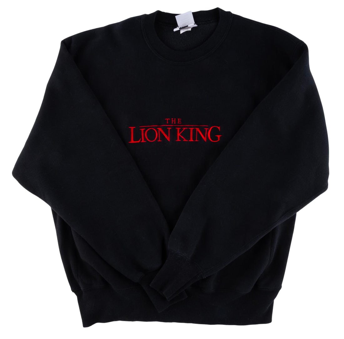 A "The Lion King" Sweatshirt.: (Disney Promotional Products, 1994) A "The Lion King" sweatshirt with an embroidered title on the chest. This size X-Large sweatshirt has a "Disney Promotional Products" label, and was not available