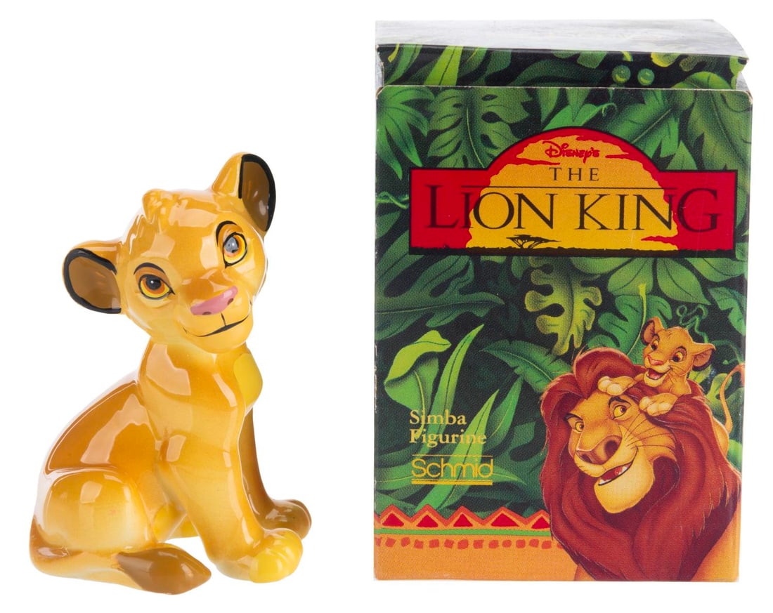 A Simba "The Lion King" Figurine.: (Schmid, 1990s) A ceramic figurine of Simba from the breathtaking 1994 Disney animated feature, "The Lion King." Measuring 2" x 2.75" the figure and its original box are in fine condition.