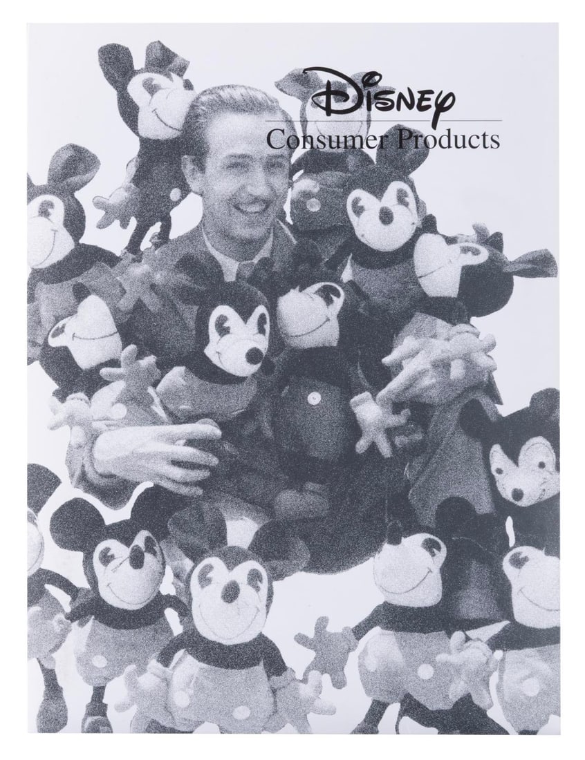 A 1999 Disney Consumer Products New Hire Folder.: (Disney, 1999) An onboarding packet given to new hires to Disney Consumer Products in 1999. Included are then-recent issues of theDisney Catalog and internal CP News magazine, and documents with overv