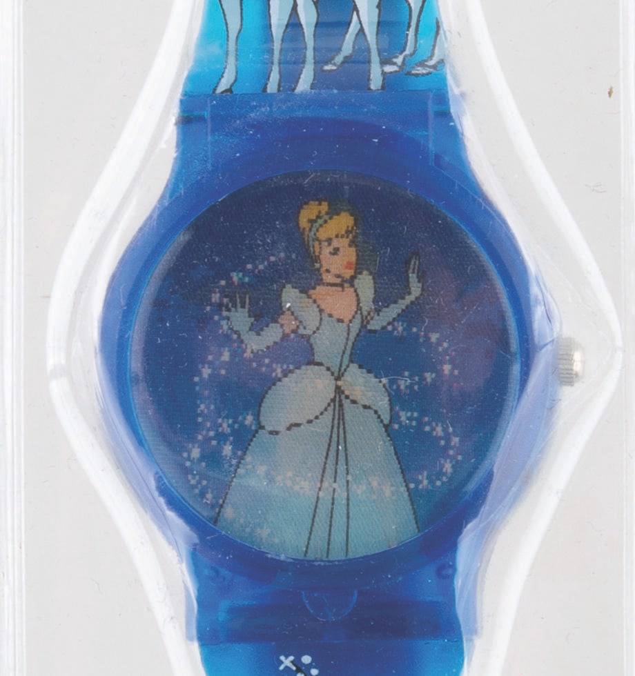 A "Cinderella" Magic Motion Lenticular Watch.: (Disney, 1990s) A "Cinderella" magic motion lenticular watch, showing the ball gown transformation. Measuring 1.5" x 9.5", the watch is in fine condition, requiring a battery and possibly service to