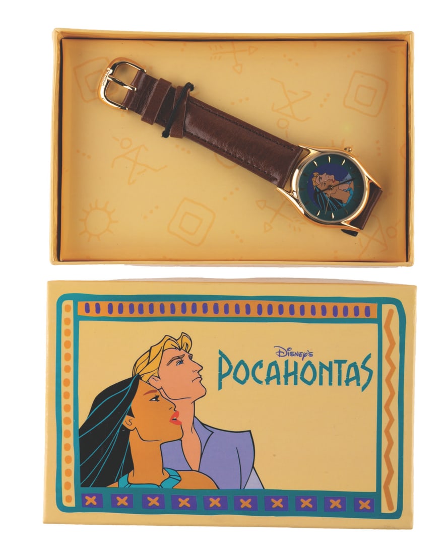 A "Pocahontas" Crew Watch in Original Box.: (Disney, 1995) A "Pocahontas" Feature Animation Crew exclusive watch in its original decorative box. The watch features Pocahontas and John Smith on its face, with a brown leather band and a gold-tone