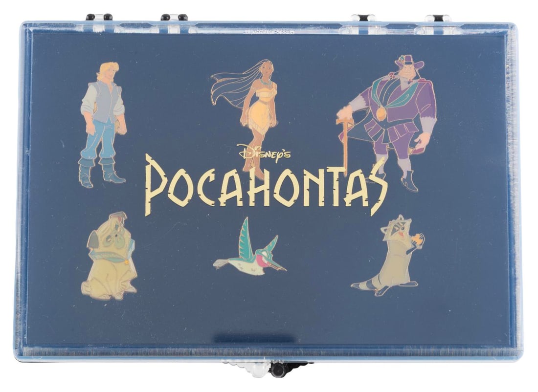 A 6-Piece "Pocahontas" Character Pin Set.: (Disney Store, 1995) A six-piece "Pocahontas" pin set featuring Pocahontas, John Smith, Meeko, Flit, Percy, and Governor Ratcliffe. Measuring approximately 1.5" x 1" each, the pins are in fine
