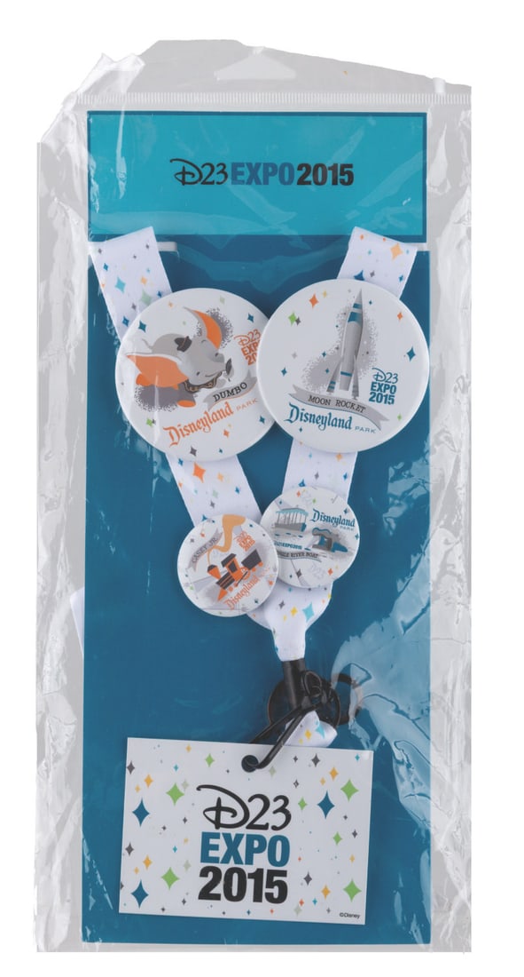 A D23 Expo 2015 Disneyland Button Set.: (Disneyland, 2015) A button and convention lanyard from the D23 Expo 2015. Buttons feature the Disneyland attractions, including Dumbo, Moon Rocket, Jungle River boat, and Casey Jr. With buttons