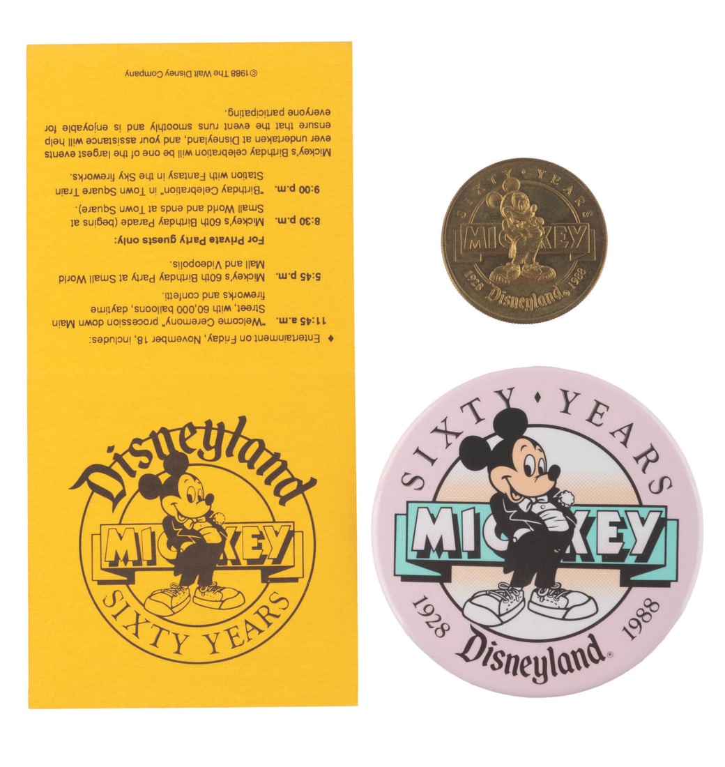A Collection of Mickey's 60th Birthday Souvenirs.: (Disneyland, 1988) A collection of three Disneyland souvenirs celebrating Mickey?s 60th birthday including a coin, button, and an itinerary of festivities in the Park. The items are in very good